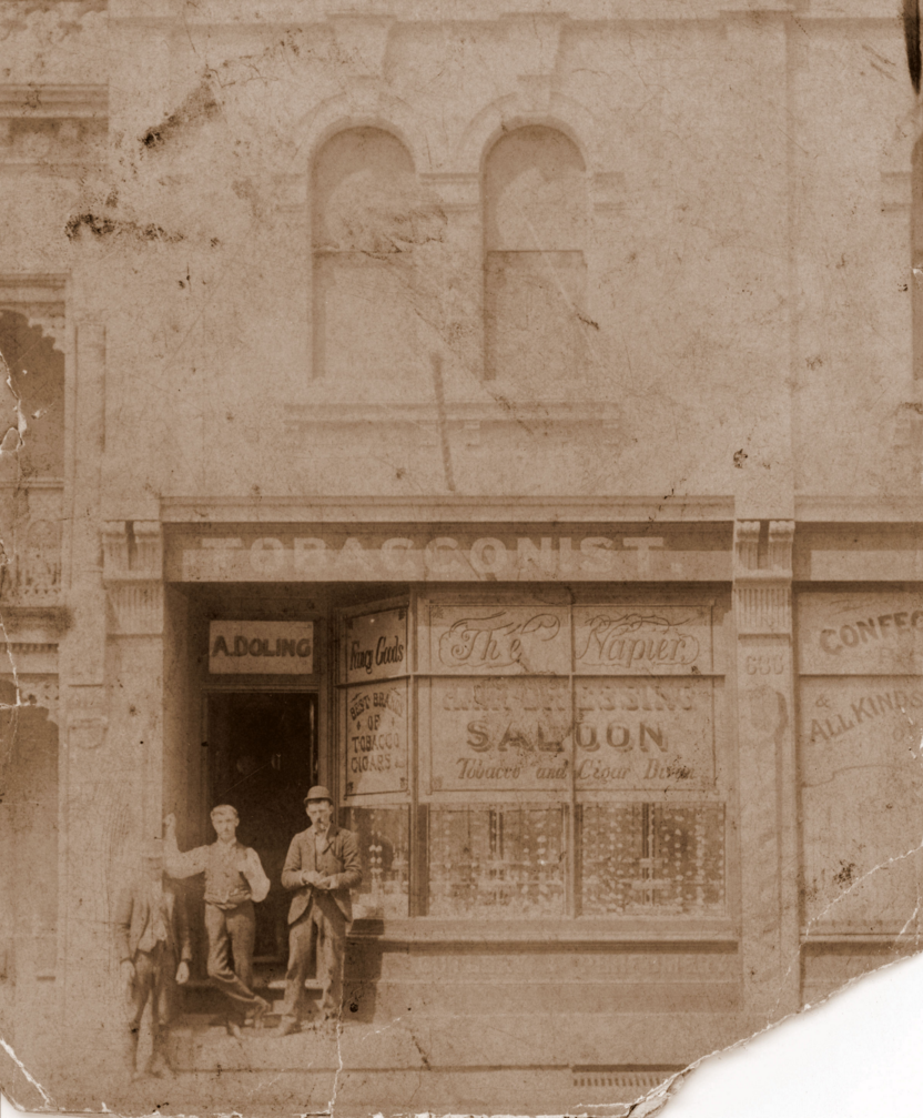 Albert Edward Doling senior (centre) in front of his hairdressing and tobacconist saloon in Ultimo, courtesy Elaine Doling